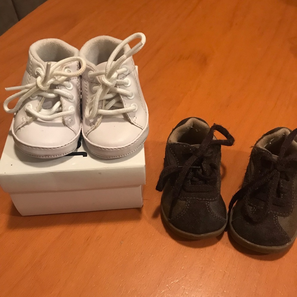 Infant shoes 2 pairs in size 2. One brown pair and one white pair.
